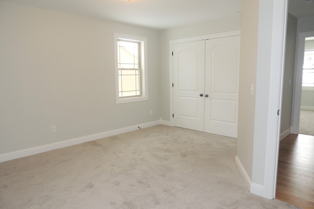 Lot 77 Alwin Place Springfield, MA 01128 - Photo 14 of 30 an empty room with windows and closet
