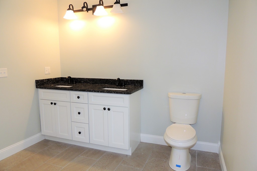 Lot 77 Alwin Place Springfield, MA 01128 - Photo 17 of 30 a bathroom with a granite countertop toilet and sink