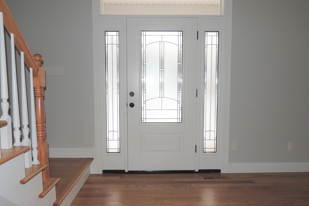 Lot 77 Alwin Place Springfield, MA 01128 - Photo 2 of 30 an empty room with wooden floor and windows