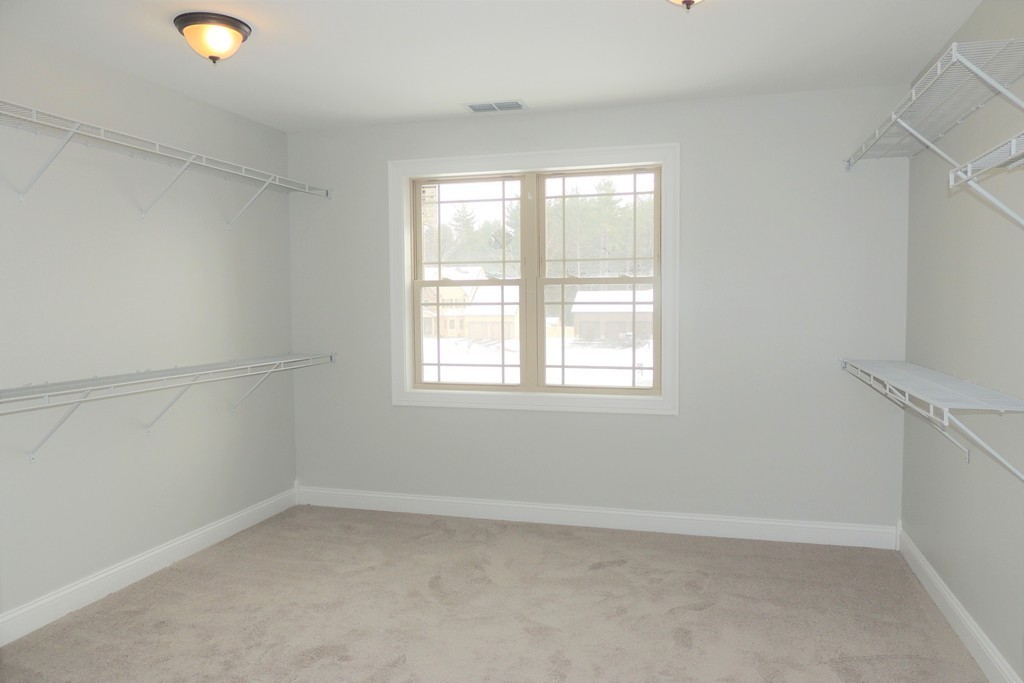 Lot 77 Alwin Place Springfield, MA 01128 - Photo 21 of 30 an empty room with a window