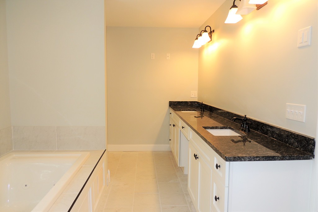 Lot 77 Alwin Place Springfield, MA 01128 - Photo 22 of 30 a bathroom with a sink and a mirror