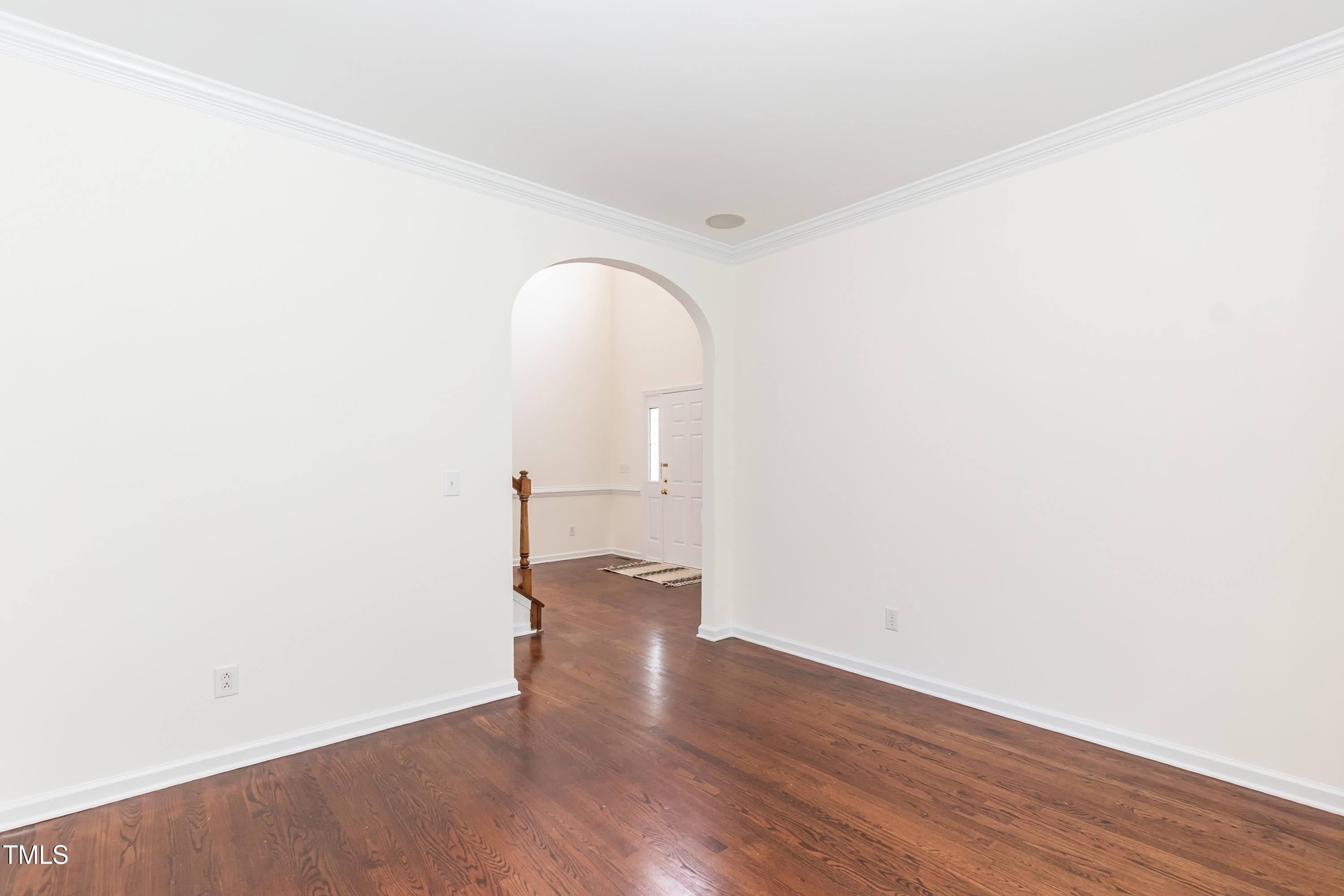 212 Mickleson Ridge Drive Raleigh, NC 27603 - Photo 12 of 58 a view of empty room with wooden floor