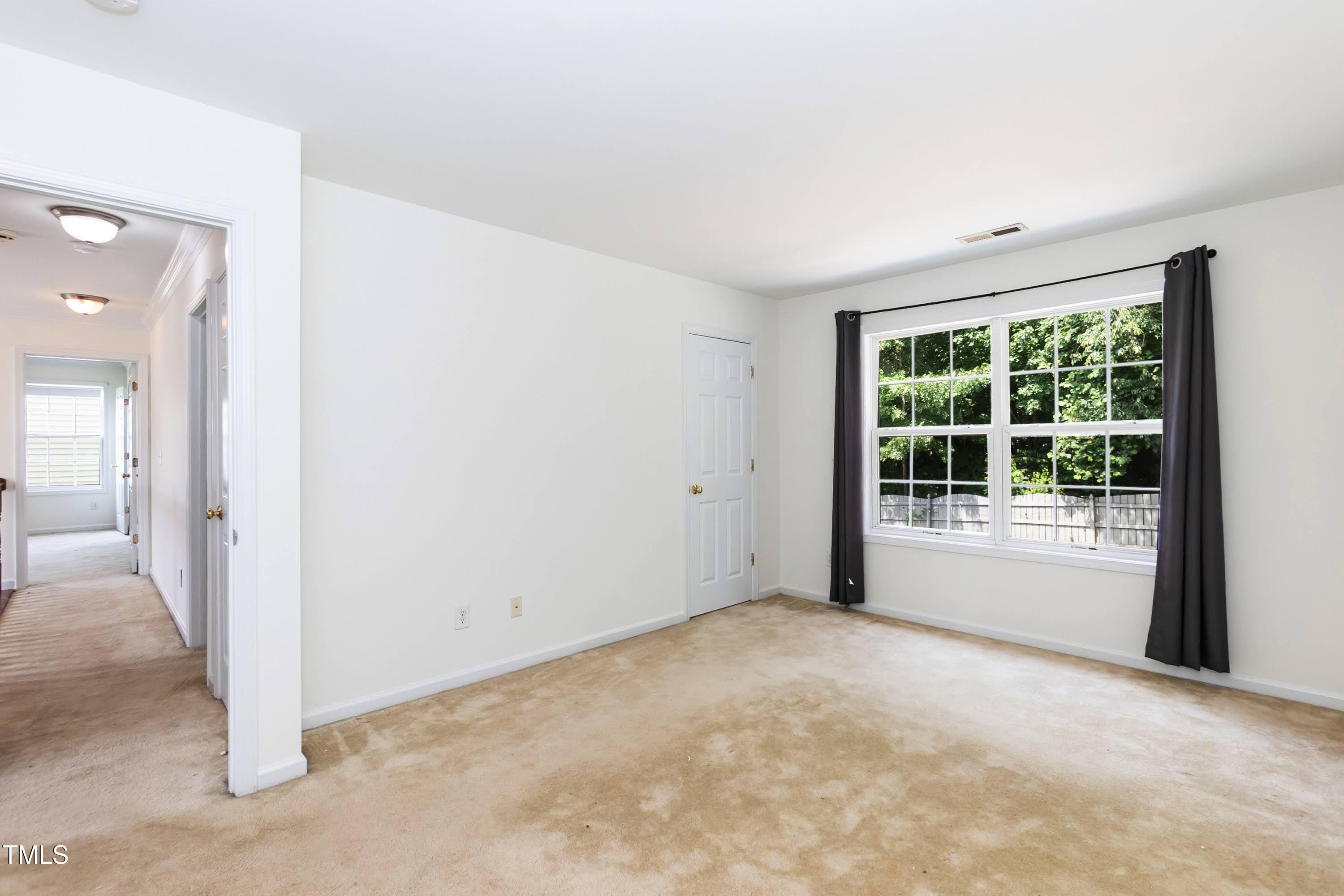 212 Mickleson Ridge Drive Raleigh, NC 27603 - Photo 33 of 58 a view of an empty room with a window