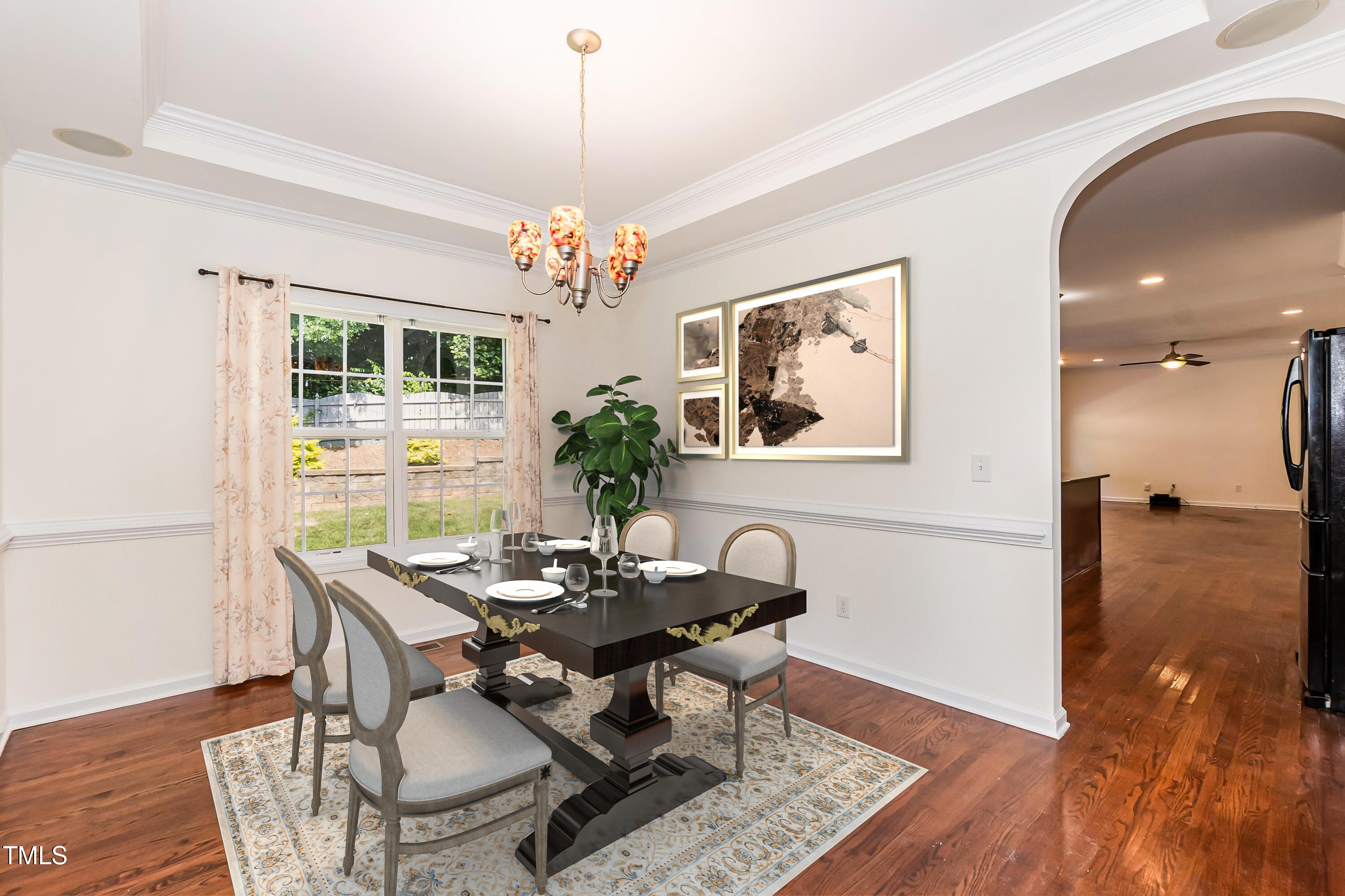 212 Mickleson Ridge Drive Raleigh, NC 27603 - Photo 8 of 58 a view of a dining room with furniture wooden floor and a chandelier