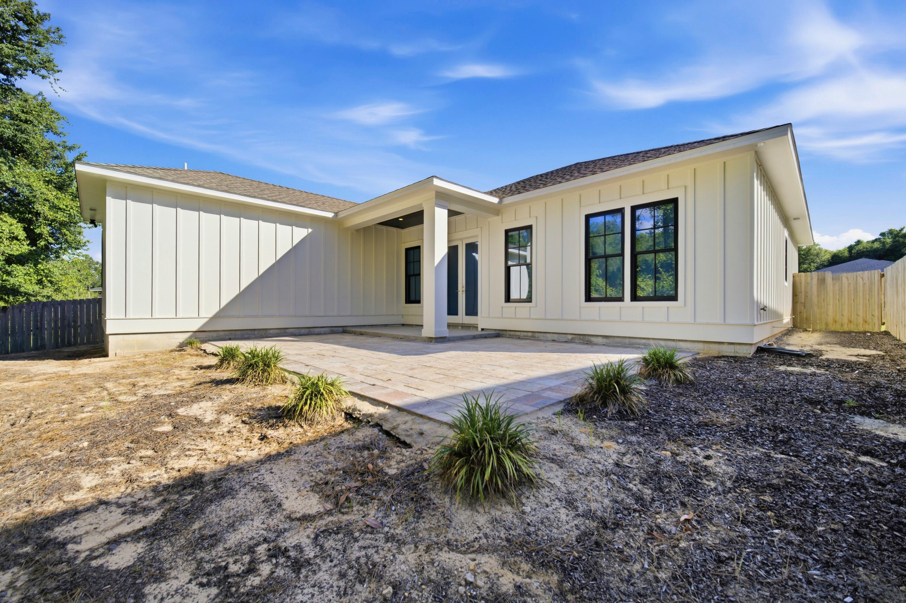 120 Lillian Way Crestview, FL 32536 - Photo 22 of 67 a front view of a house with garden