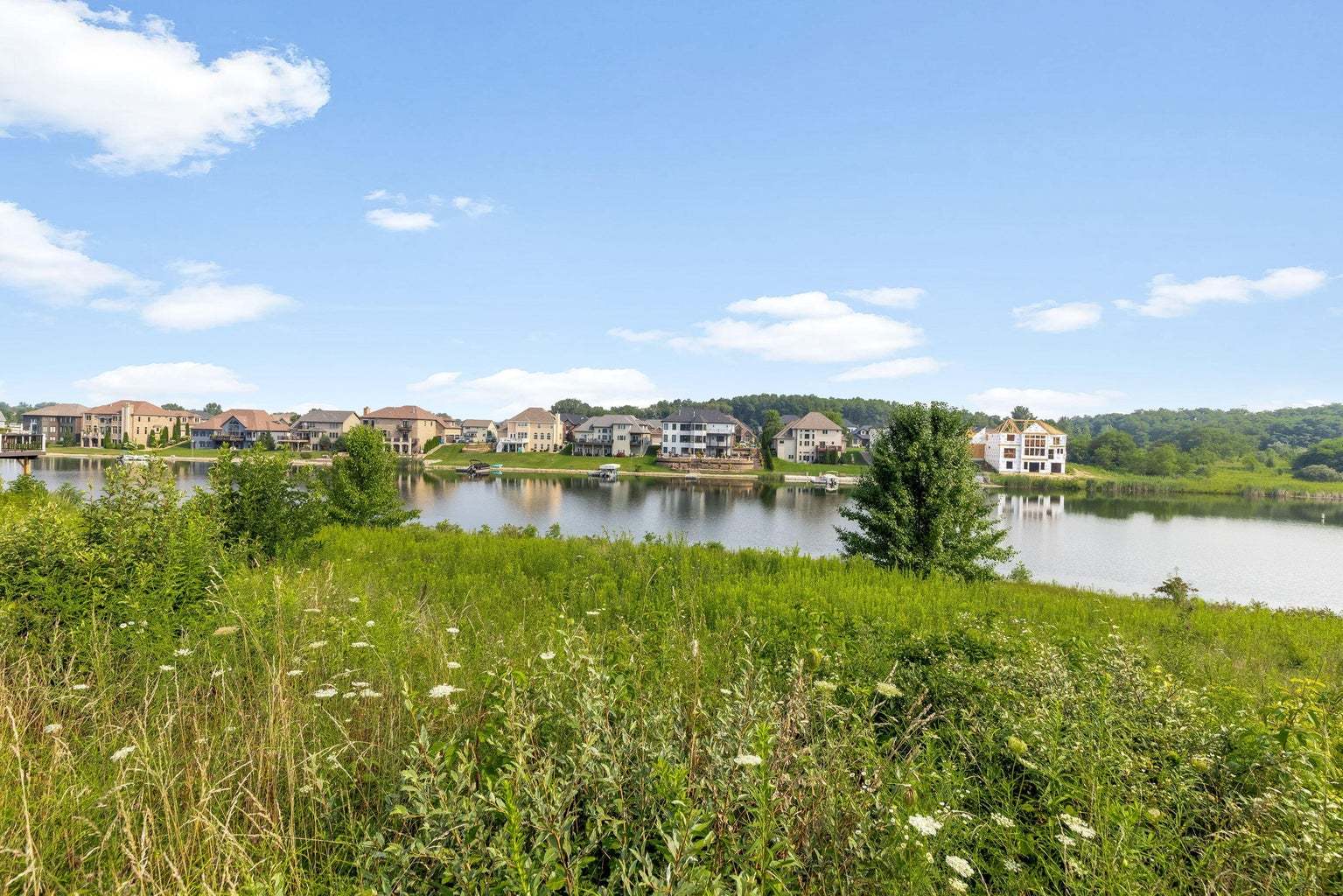 9275 Doubletree Drive South Winfield, IN 46307 - Photo 14 of 30 a view of a lake with houses in the back