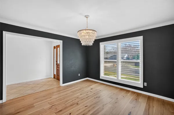 a bedroom with a large bed and furniture