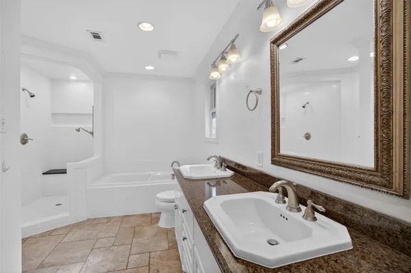 a bathroom with a bathtub and toilet