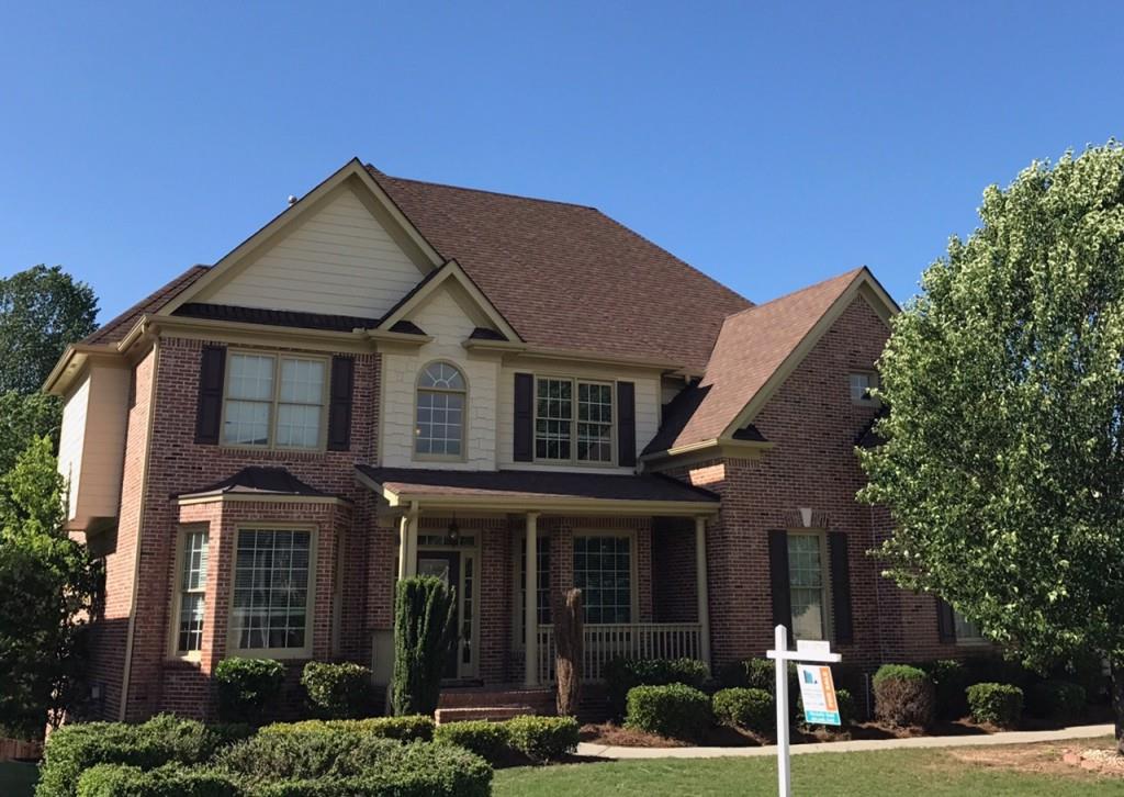 642 Arbor Ridge Loganville, GA 30052 - Photo 1 of 1 a front view of a house with a yard