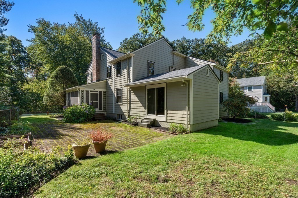 580 Quinobequin Road Newton, MA 02468 - Photo 23 of 25 front view of a house with a yard