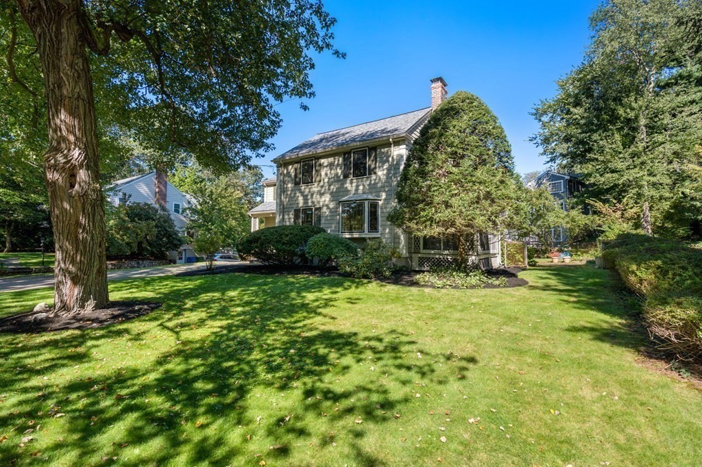 580 Quinobequin Road Newton, MA 02468 - Photo 24 of 25 a view of a house with a yard