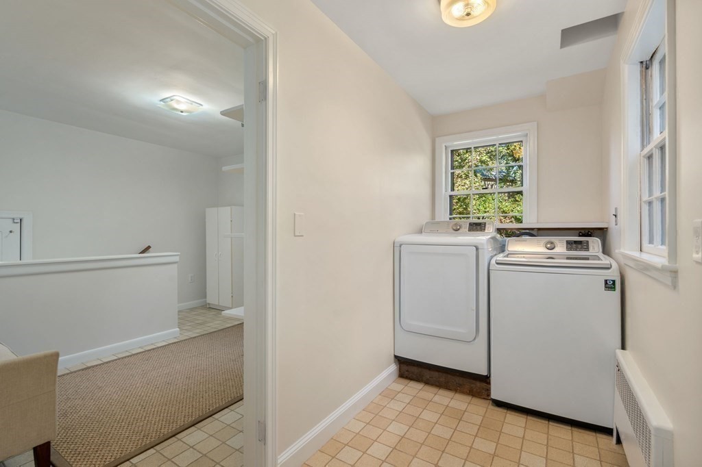 580 Quinobequin Road Newton, MA 02468 - Photo 7 of 25 a room with dryer and washer