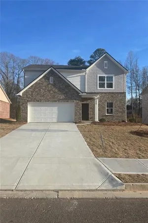 a front view of a house with yard