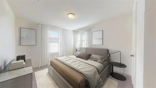 a bedroom with a bed and a couch