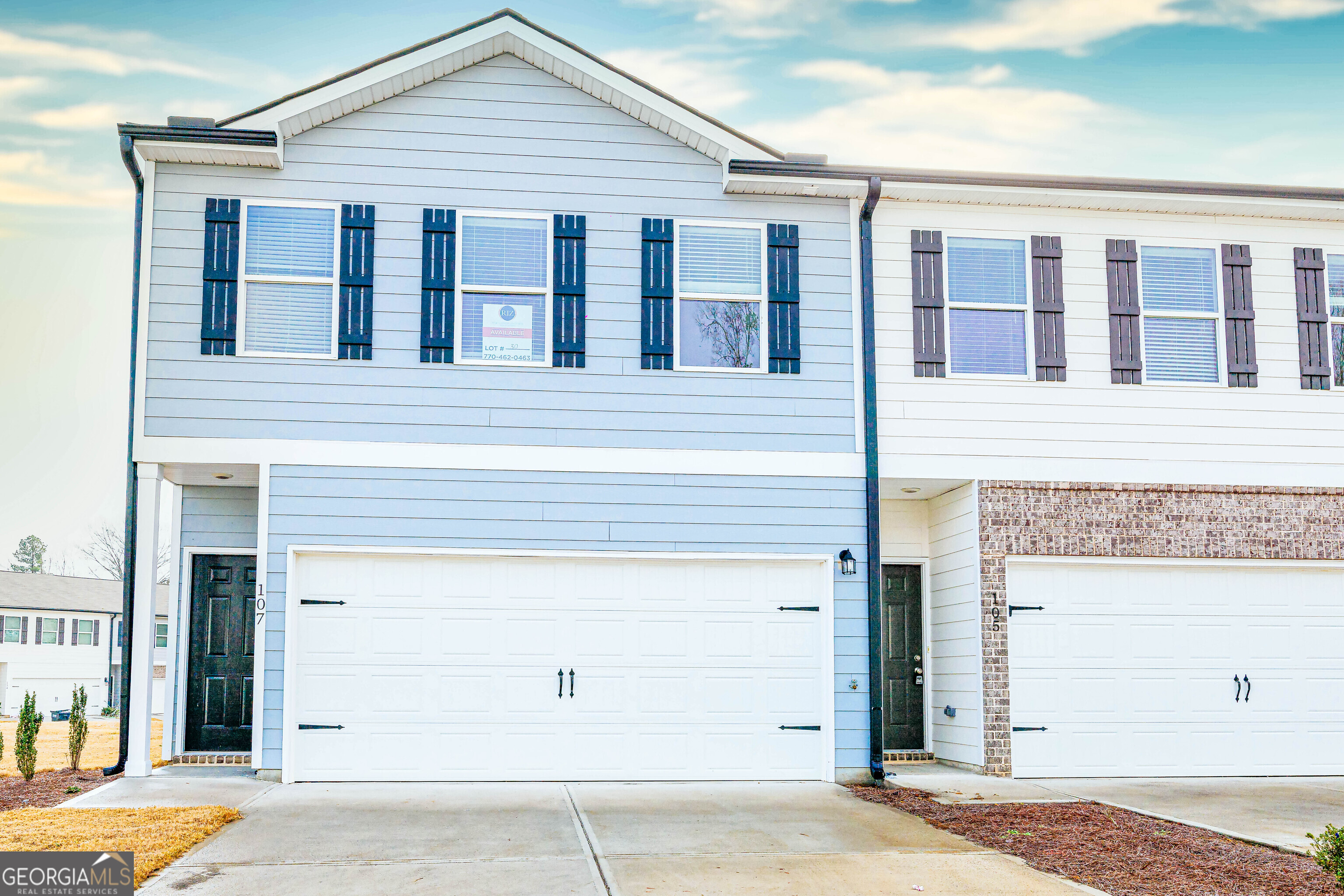 107 Brexley Drive Calhoun, GA 30701 - Photo 1 of 28 a front view of a house with a garage