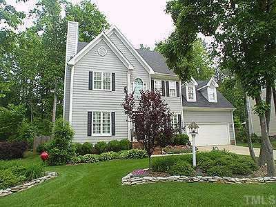 5816 Ventry Court Raleigh, NC 27613 - Photo 1 of 1 a front view of a house with a garden and yard