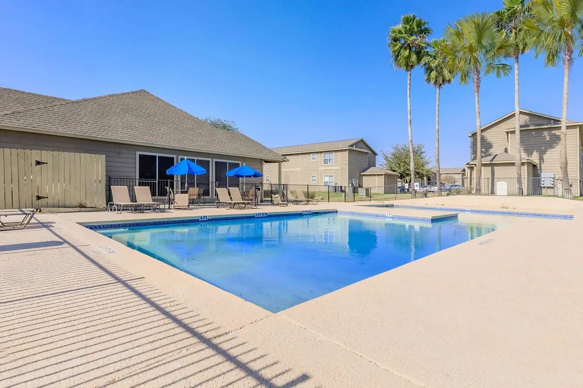409 Riverhill Loop Laredo, TX 78046 - Photo 11 of 12 a swimming pool with outdoor seating and yard