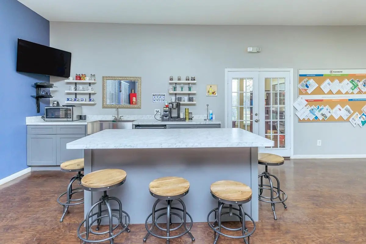 409 Riverhill Loop Laredo, TX 78046 - Photo 7 of 12 a kitchen with a table and chairs in it