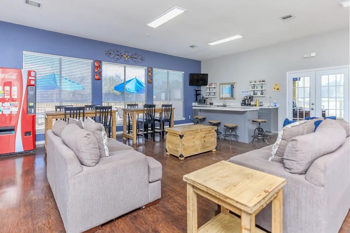 409 Riverhill Loop Laredo, TX 78046 - Photo 8 of 12 a living room with furniture and a flat screen tv