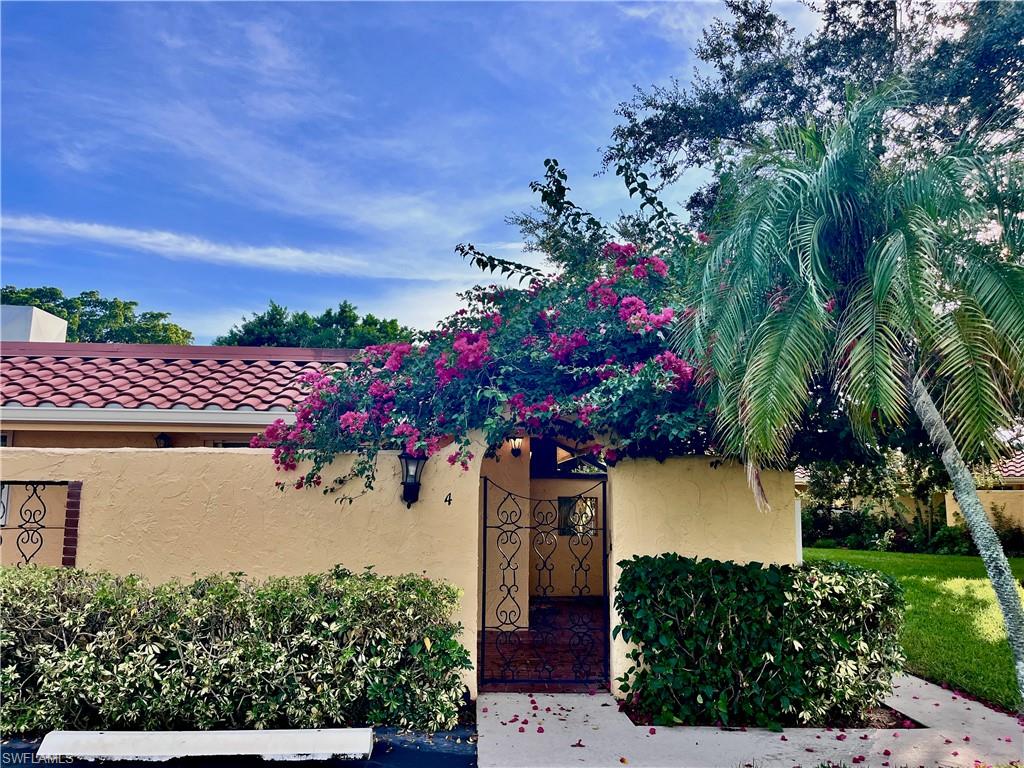 186 Harrison Road, Unit H4 Naples, FL 34112 - Photo 1 of 34 Entry to Spanish Villa and open lanai area