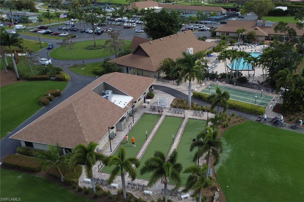 186 Harrison Road, Unit H4 Naples, FL 34112 - Photo 17 of 34 Aerial overview of the 3 Bocce courts next to the 13th hole of the Palmetto Par 55 golf course and near the shuffleboard courts.