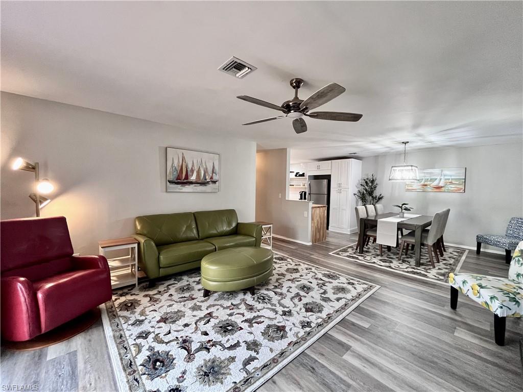 186 Harrison Road, Unit H4 Naples, FL 34112 - Photo 4 of 34 Living room featuring light wood-style flooring and a ceiling fan