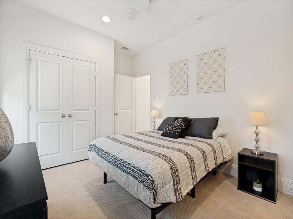 732 West 7th Street Dallas, TX 75208 - Photo 22 of 25 Carpeted bedroom featuring a double-door closet, ceiling fan, recessed lighting, and white walls