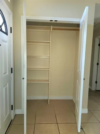 a view of an empty walk in closet