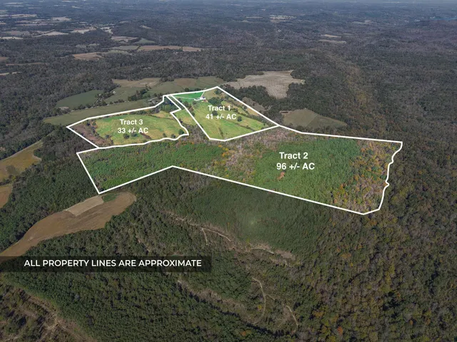 a view of a workspace with wooden floor and bathroom view