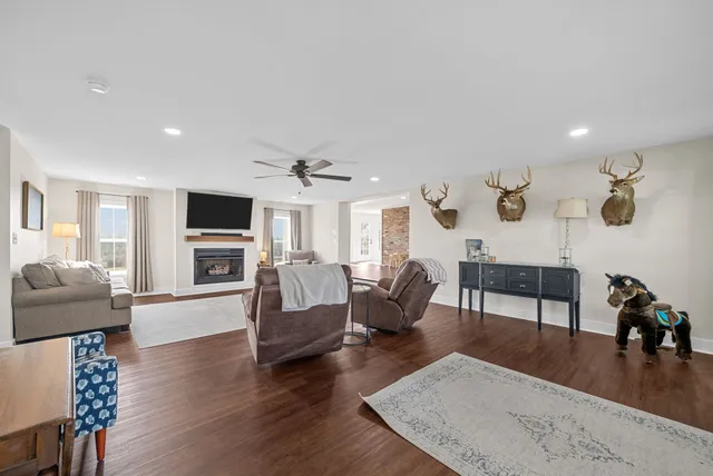a bathroom with a granite countertop sink a toilet and a mirror
