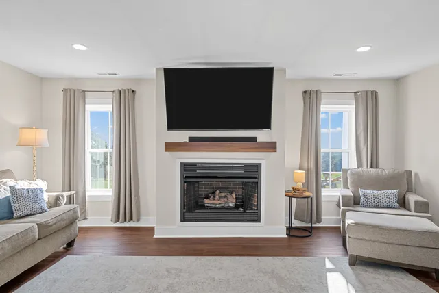 a view of an empty room and wooden floor