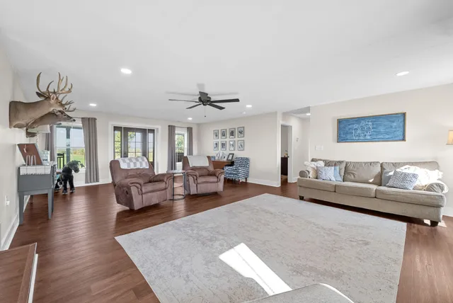 a backyard of a house with lots of green space and plants