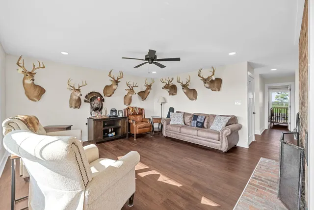 an aerial view of a residential houses with outdoor space and a lake view