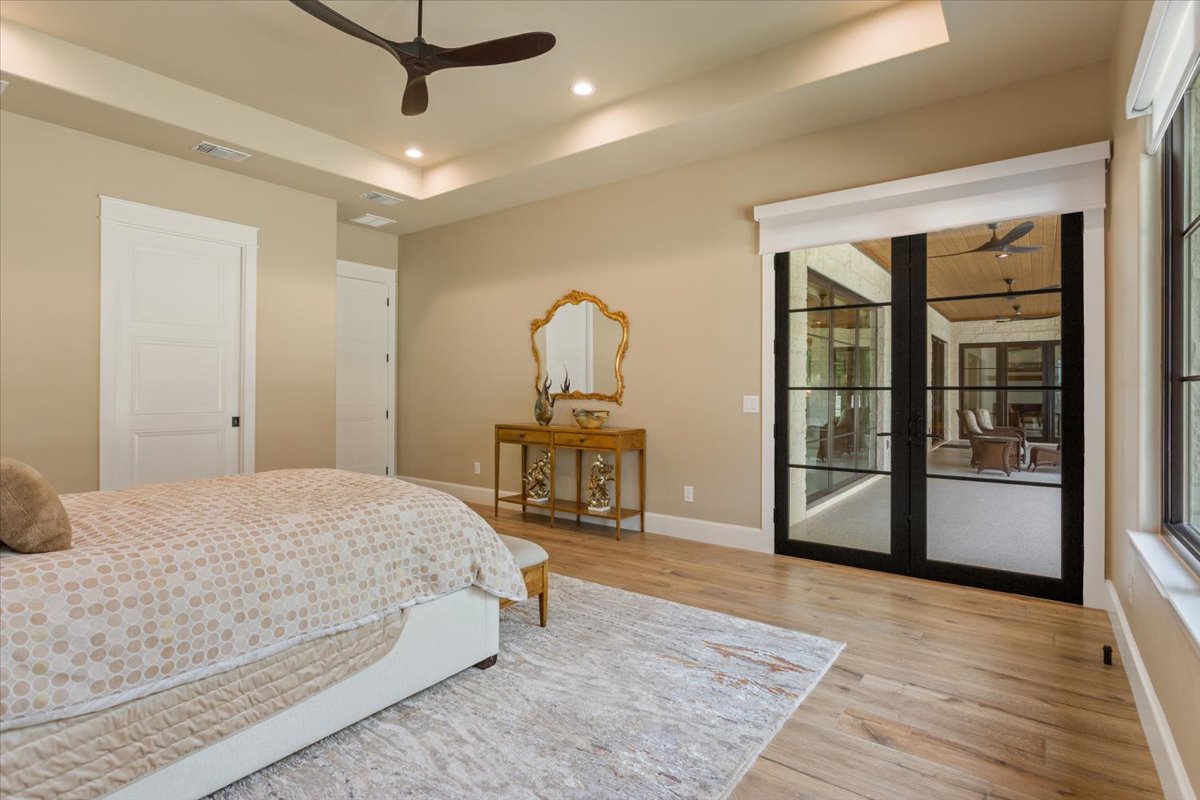 309 Highland Spring Lane Georgetown, TX 78633 - Photo 21 of 40 Double doorway to the covered patio. Use your remote to end your day and put the shades down when you are ready to sleep...