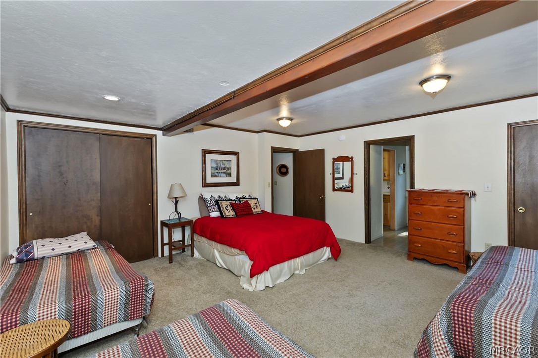 691 Cottage Grove Road Lake Arrowhead, CA 92352 - Photo 19 of 28 a bedroom with a bed and a dresser