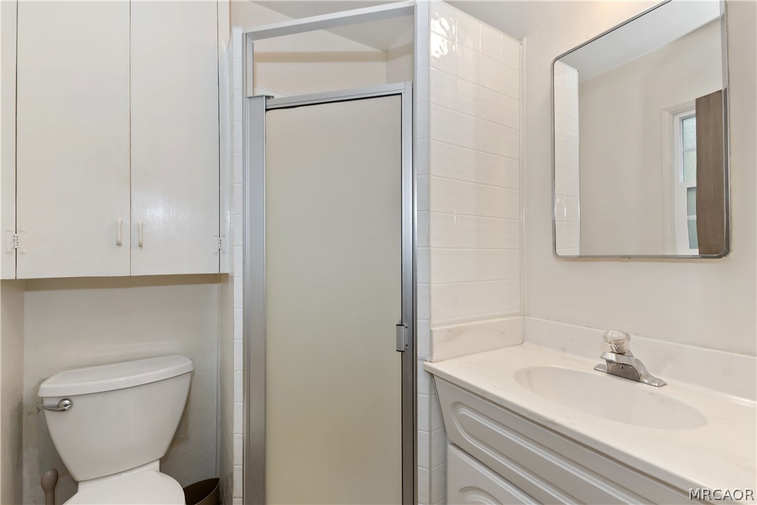 691 Cottage Grove Road Lake Arrowhead, CA 92352 - Photo 20 of 28 a bathroom with a sink toilet and vanity