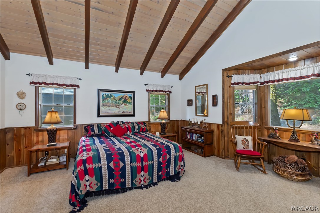 691 Cottage Grove Road Lake Arrowhead, CA 92352 - Photo 22 of 28 a bedroom with a bed and dresser with the floor