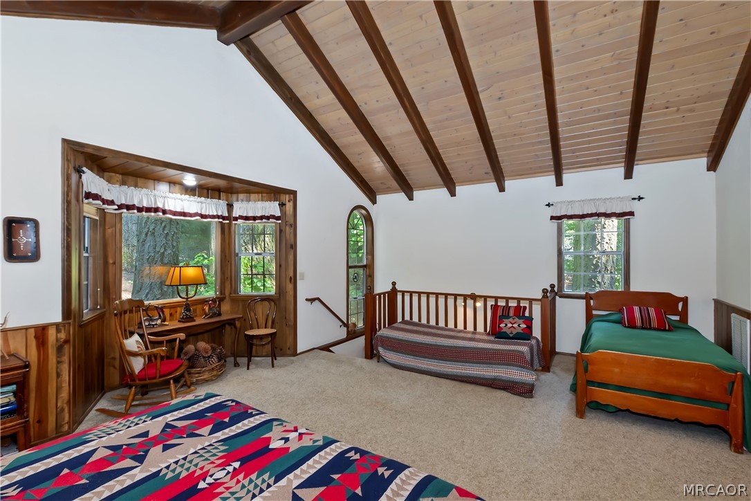 691 Cottage Grove Road Lake Arrowhead, CA 92352 - Photo 23 of 28 a bedroom with furniture and a book shelf