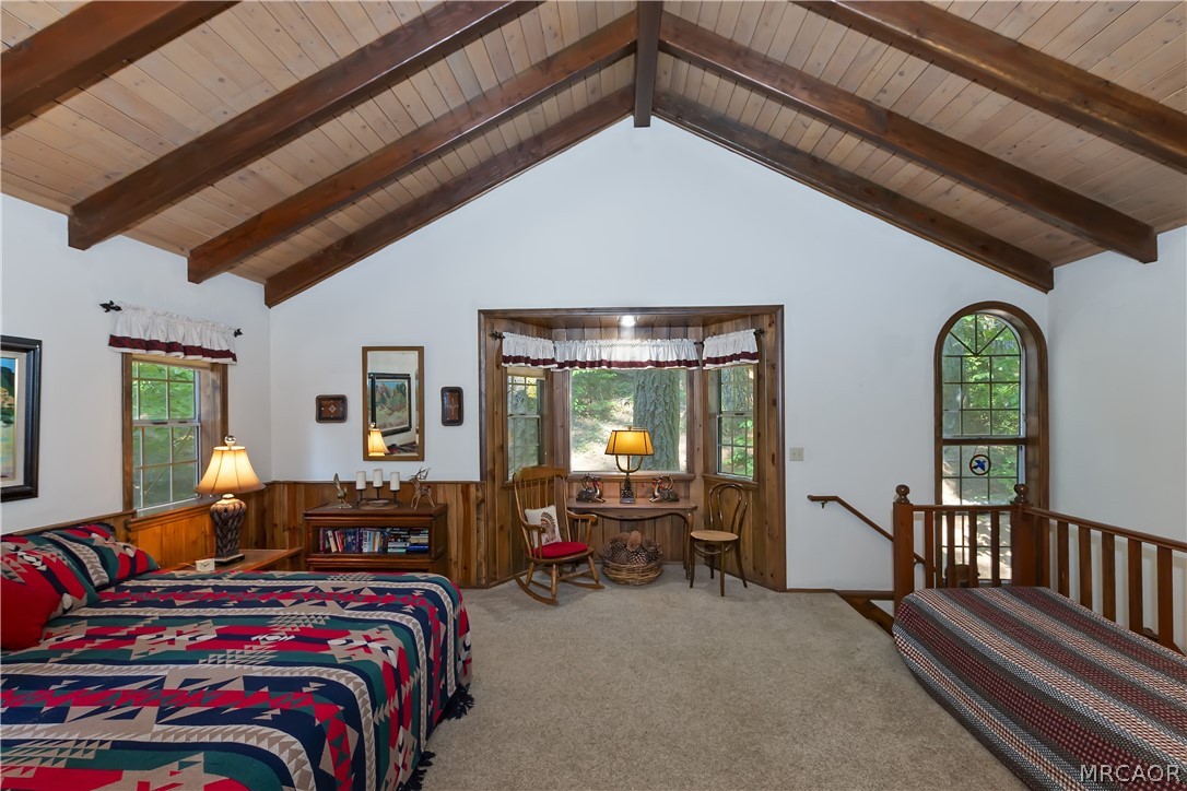 691 Cottage Grove Road Lake Arrowhead, CA 92352 - Photo 24 of 28 a bedroom with furniture and a large window