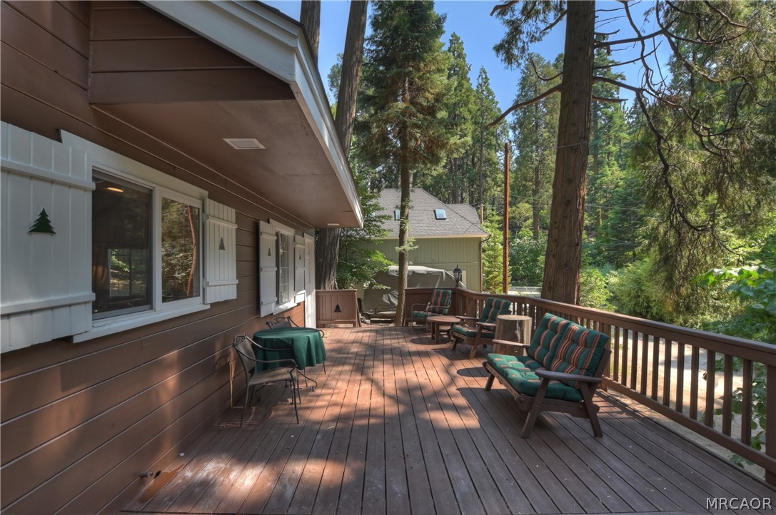 691 Cottage Grove Road Lake Arrowhead, CA 92352 - Photo 6 of 28 a view of a house with backyard and sitting area