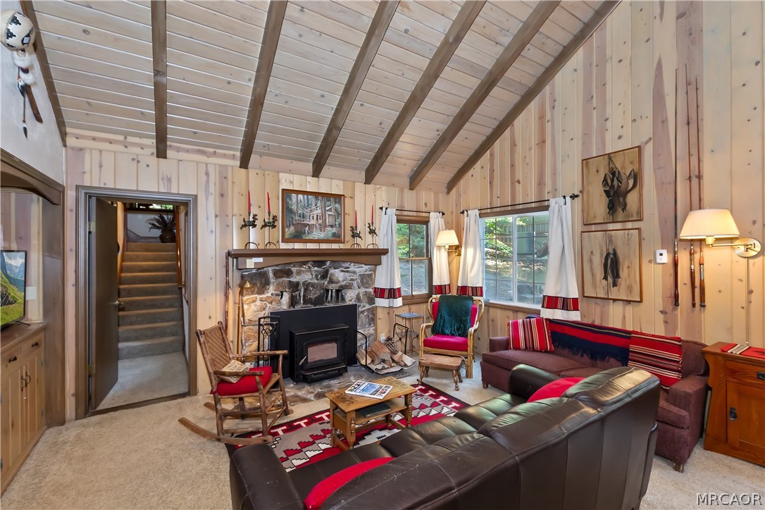 691 Cottage Grove Road Lake Arrowhead, CA 92352 - Photo 10 of 28 a living room with furniture a fireplace and a large window