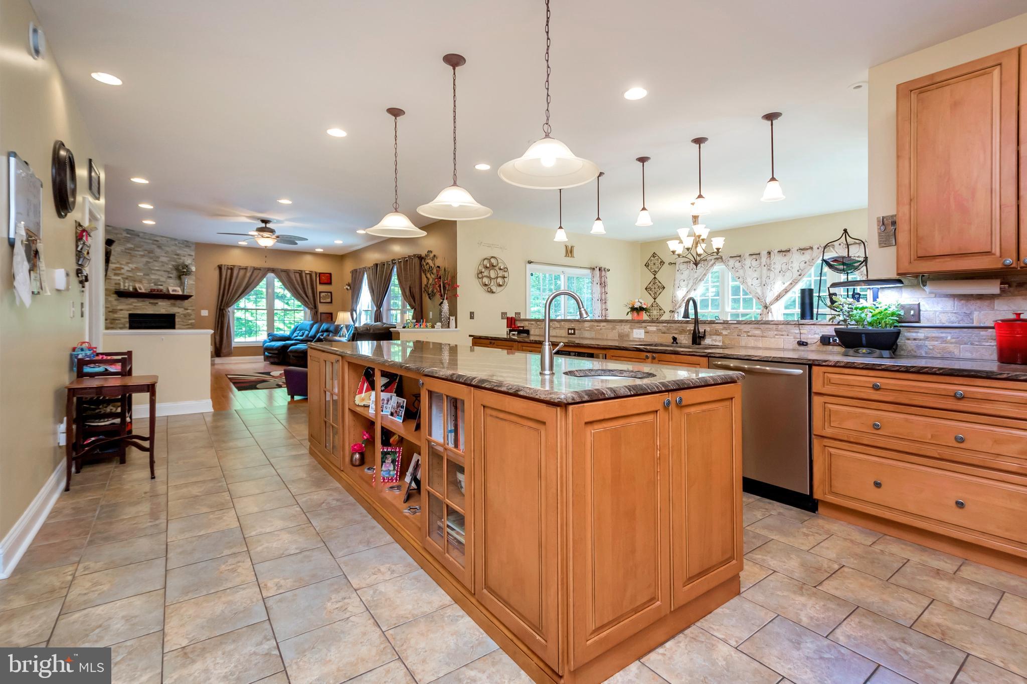 45 Crowncrest Road Fredericksburg, VA 22406 - Photo 11 of 17 a kitchen with stainless steel appliances granite countertop a stove a sink and a refrigerator