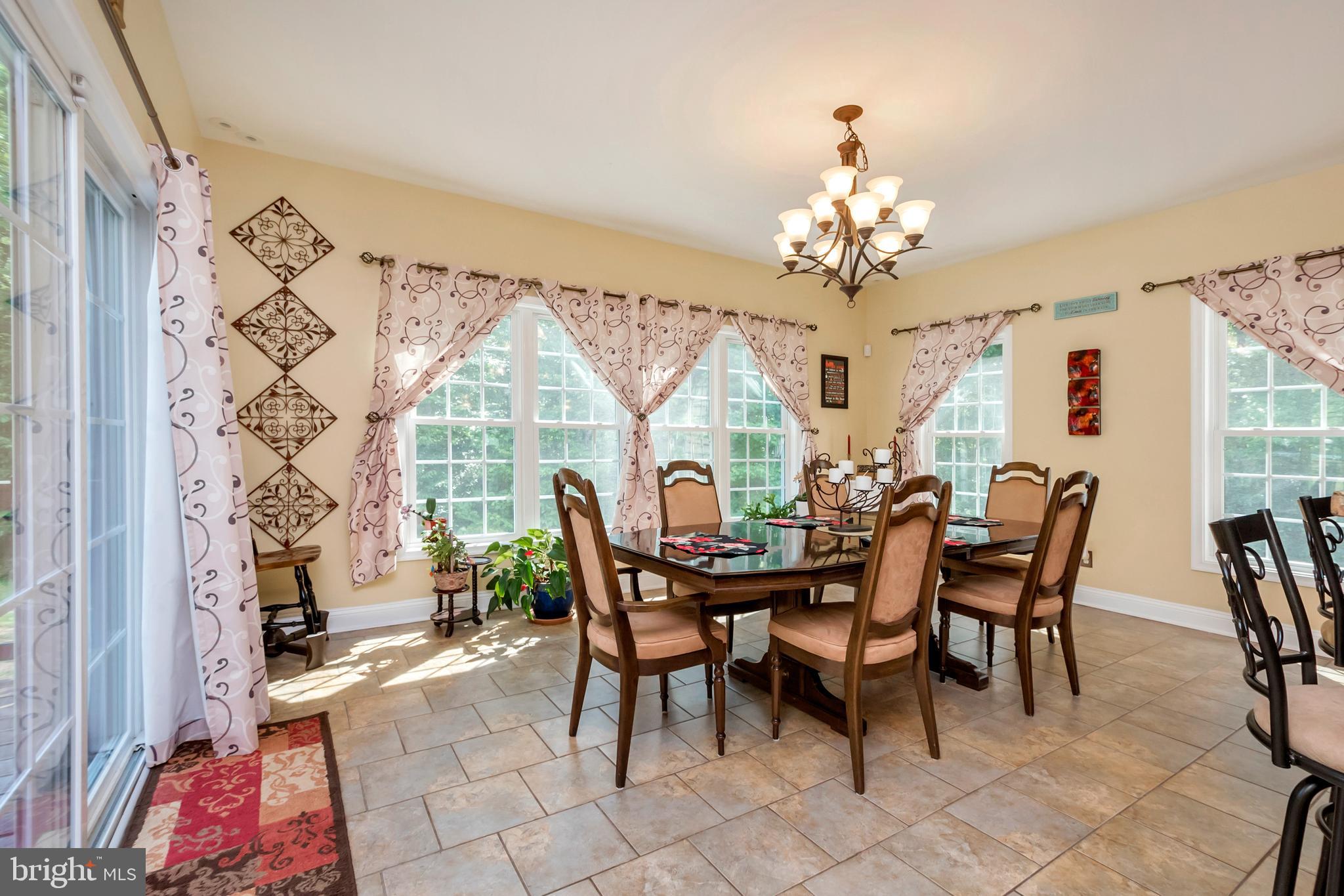 45 Crowncrest Road Fredericksburg, VA 22406 - Photo 13 of 17 a view of a dining room with furniture a chandelier and a window