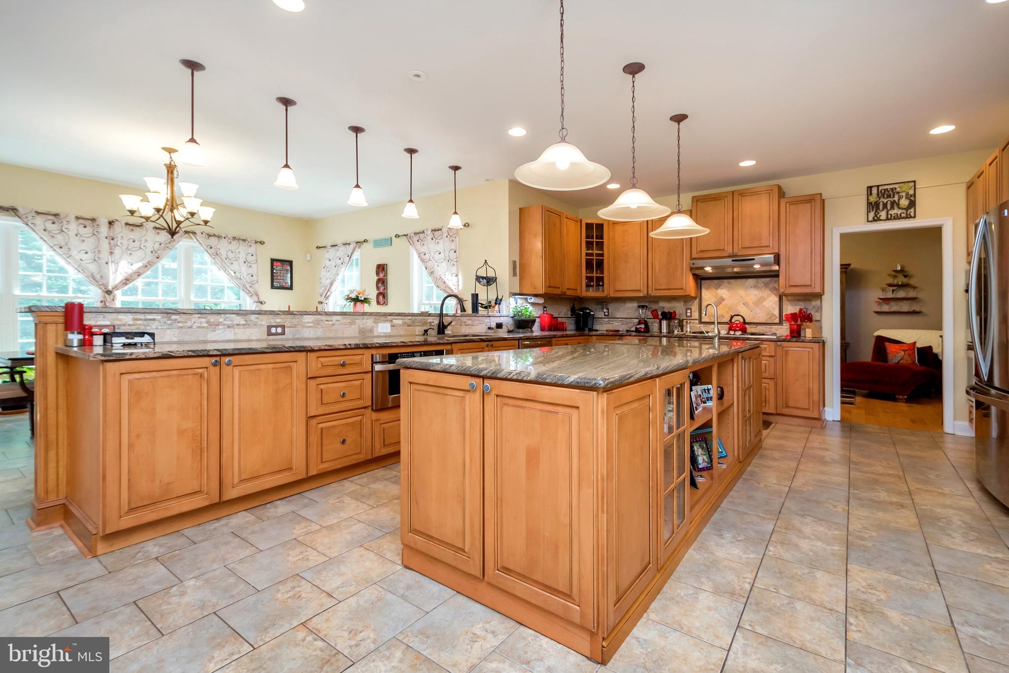 45 Crowncrest Road Fredericksburg, VA 22406 - Photo 6 of 17 a kitchen with stainless steel appliances granite countertop a stove a sink and a refrigerator
