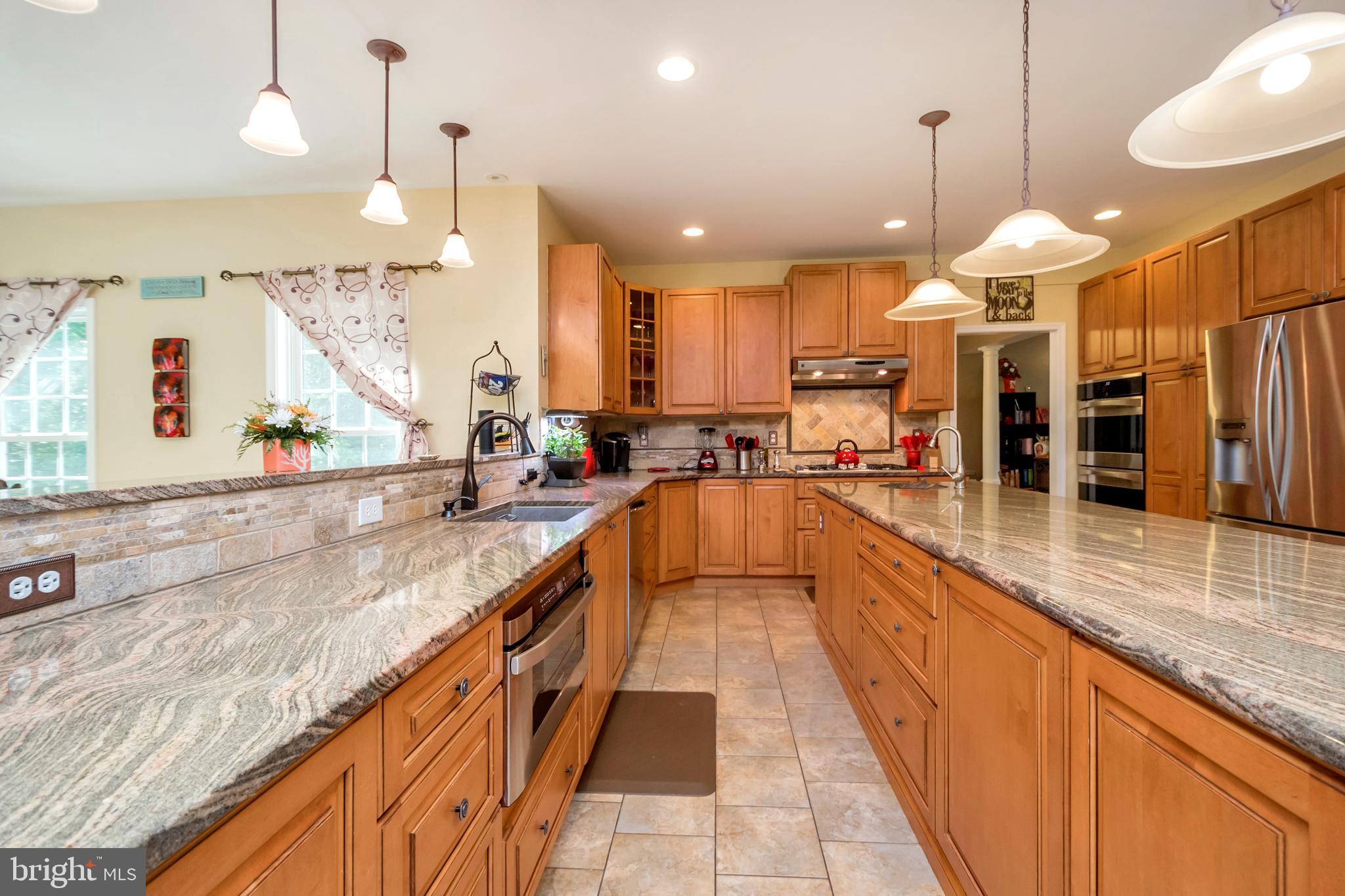 45 Crowncrest Road Fredericksburg, VA 22406 - Photo 7 of 17 a large kitchen with kitchen island a large island in it