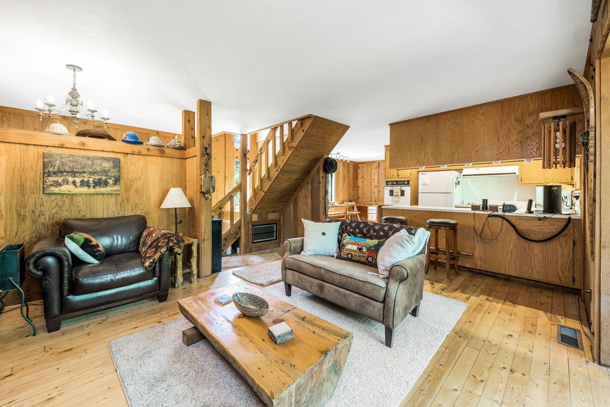 3600 Dinah Road Carnelian Bay, CA 96140 - Photo 12 of 26 a living room with furniture and a table