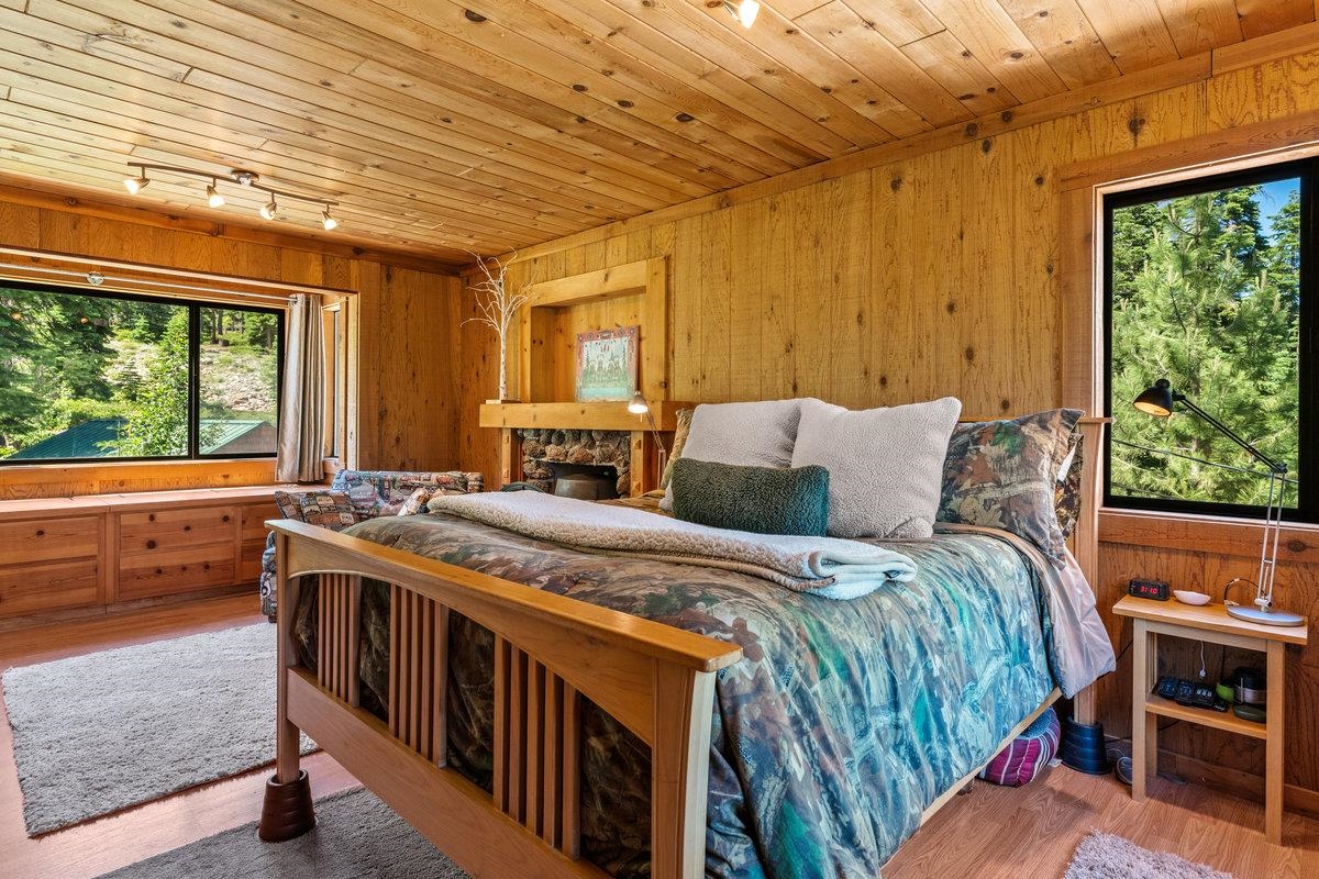 3600 Dinah Road Carnelian Bay, CA 96140 - Photo 15 of 26 a bed room with a bed and a table