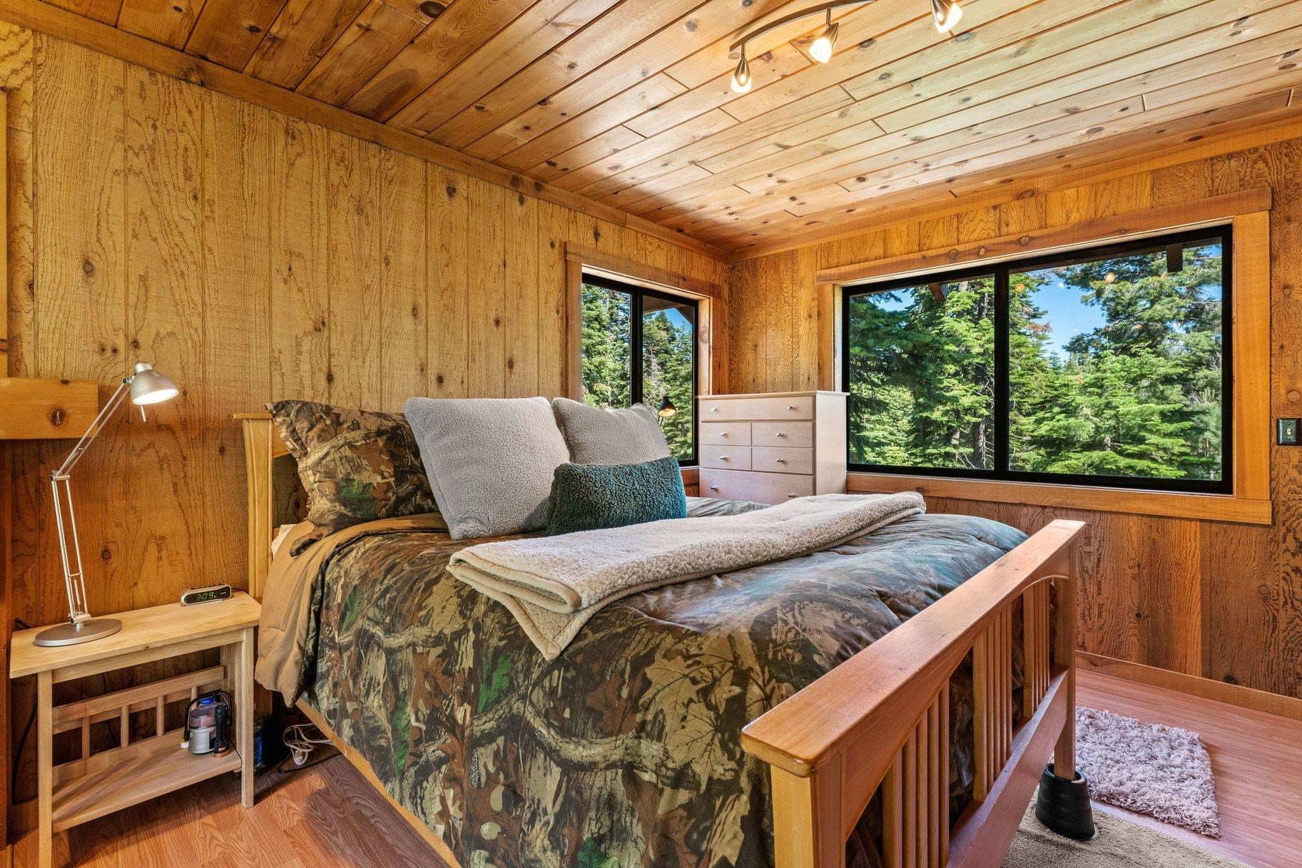 3600 Dinah Road Carnelian Bay, CA 96140 - Photo 17 of 26 a bedroom with a bed next to a window