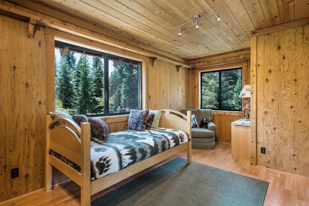 3600 Dinah Road Carnelian Bay, CA 96140 - Photo 18 of 26 a bedroom with furniture and a large window