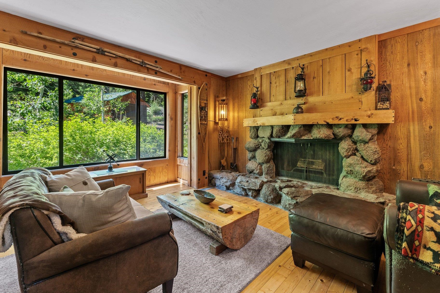 3600 Dinah Road Carnelian Bay, CA 96140 - Photo 10 of 26 a living room with furniture and a fireplace